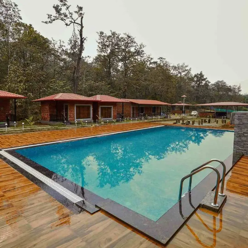 Pool and cottages at Serenity Jungle Stay, Dandeli